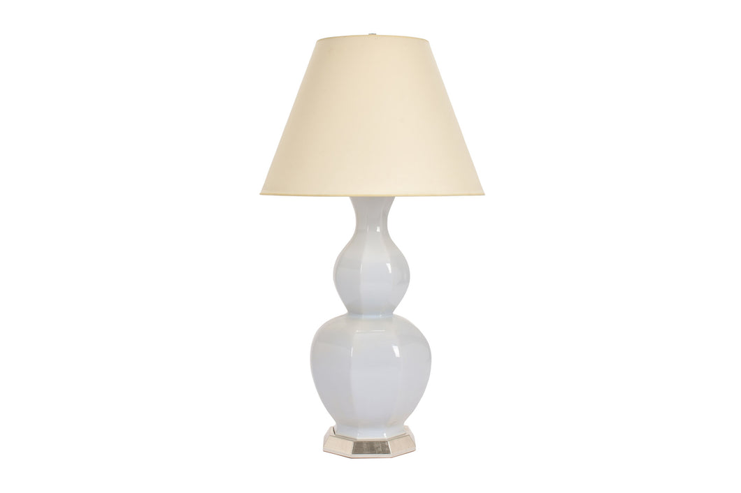 Large Alexander lamp in hope blue glaze with 12k white gold base, nickel double socket cluster, and off white vellum paper shade, on a white background.
