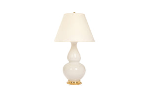 Aurora lamp in white blanc de chine glaze with 23k gold base, brass double socket cluster, and off white vellum paper shade, on a white background.