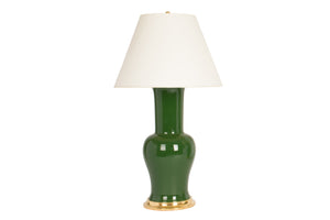 Single Garniture table lamp in dark green glaze with a 23k gold base, brass double socket cluster, and off white vellum paper shade, on a white background.