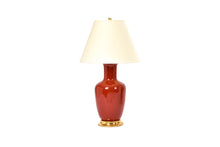 Single Ginger Jar table lamp in raspberry glaze with 23k gold base, brass double socket cluster, and off white vellum paper shade, on a white background.