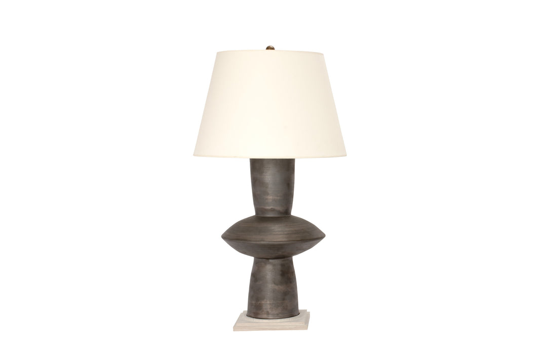 Single Medium Alexa table lamp in matte bronze glaze with bleached oak base, oil rubbed brass double socket cluster, and off white vellum paper shade.