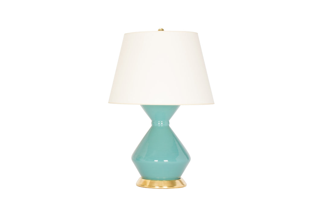 A single medium Hager lamp in aqua glaze with a 23k gold base, brass double socket cluster, and off white vellum paper shade, on a white background.